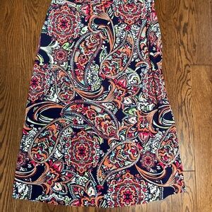 Midi-length boho floral skirt with wrap flap. Elastic waist.